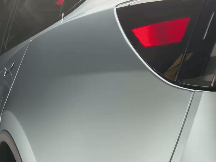 Close-up of a satin Colour PPF finish applied to a Model Y rear quarter panel